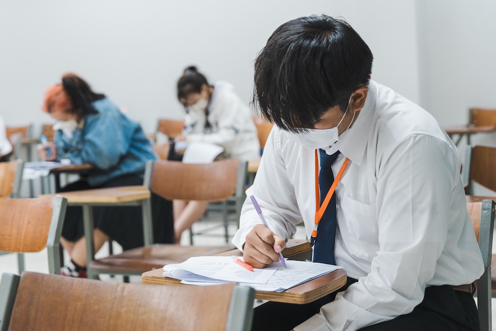 Student writing during an admissions-related session